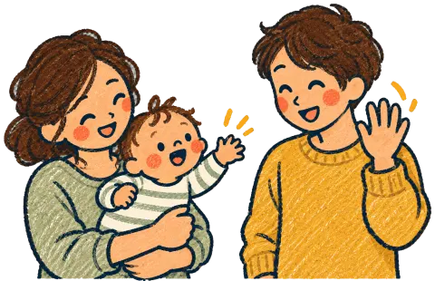 A parent holding a baby who waves at the other parent.